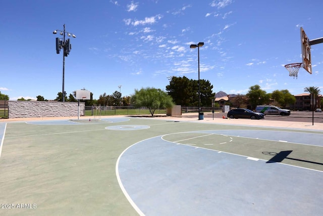 view of sport court featuring community basketball court and fence