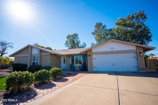 ranch-style home featuring a garage