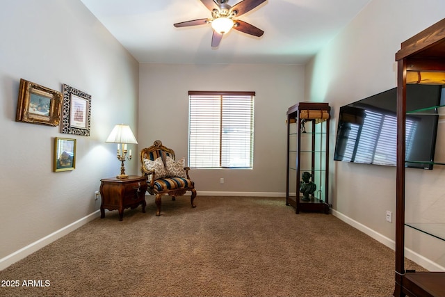 sitting room featuring carpet floors, ceiling fan, and baseboards