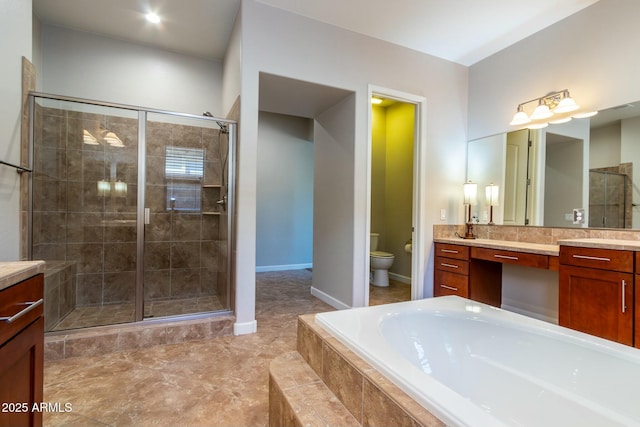 full bathroom with a shower stall, toilet, and vanity