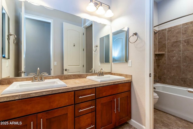 full bath featuring bathtub / shower combination, a sink, toilet, and double vanity