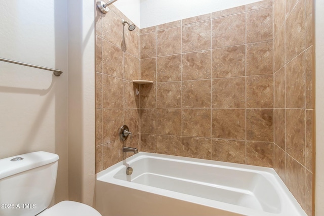 bathroom featuring bathing tub / shower combination and toilet