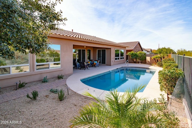 view of pool featuring a patio area and a fenced backyard