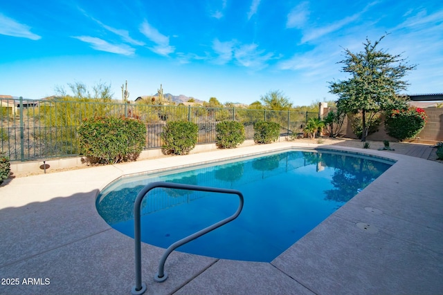 view of swimming pool featuring a patio, a fenced backyard, and a fenced in pool