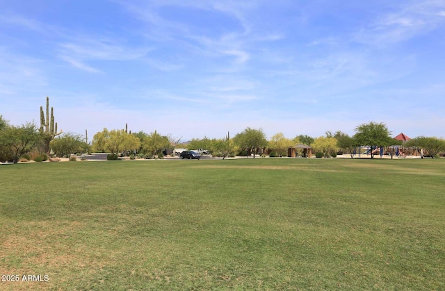 view of home's community with a yard