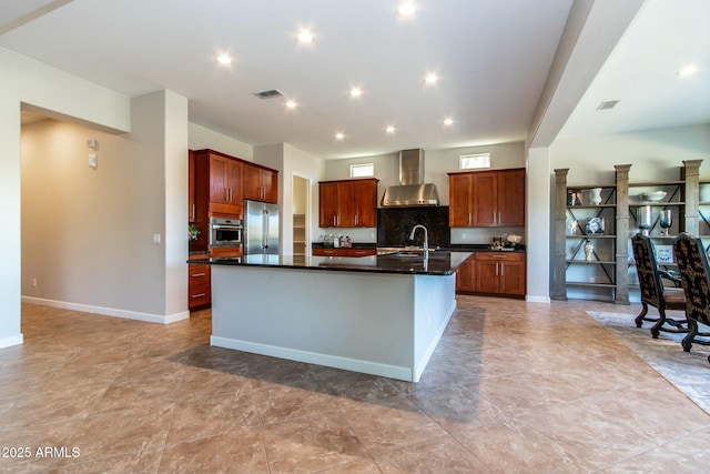 kitchen with stainless steel appliances, dark countertops, visible vents, and wall chimney exhaust hood