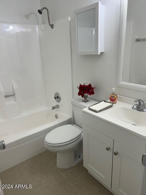 full bathroom featuring tile patterned flooring, vanity, shower / bathtub combination, and toilet