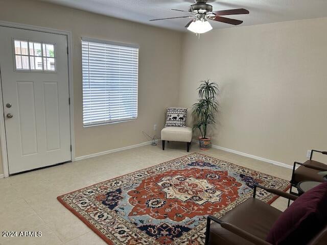 foyer entrance featuring a wealth of natural light and ceiling fan