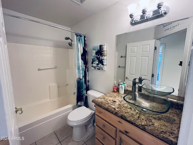 bathroom featuring tile patterned flooring, shower / bath combination with curtain, toilet, and vanity