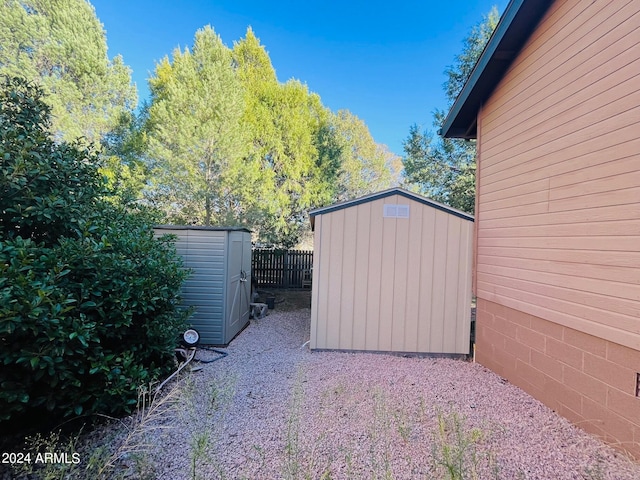 view of shed with fence