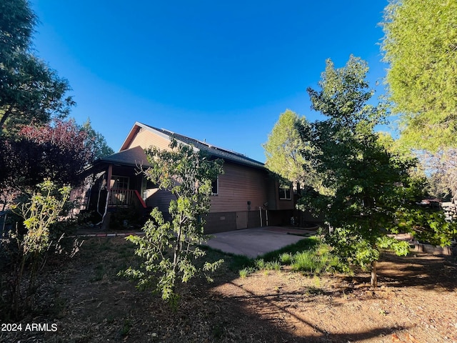 back of property with a patio area