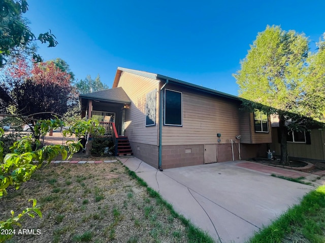 view of property exterior featuring crawl space