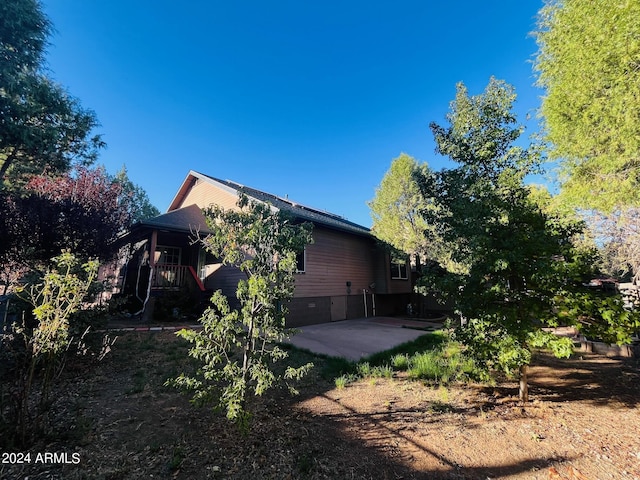 view of property exterior featuring a patio area