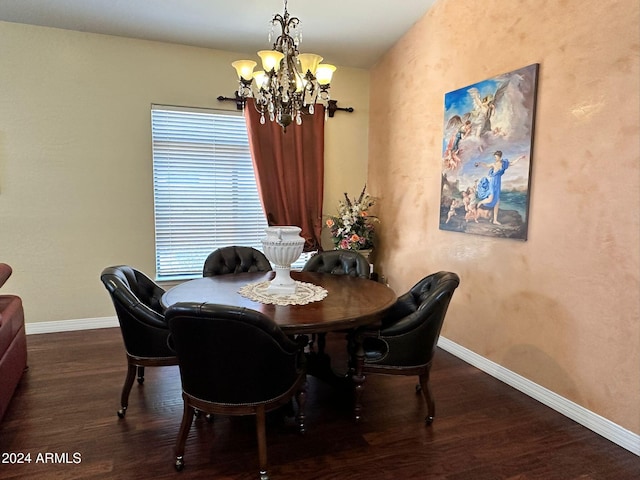 dining area featuring wood-type flooring and an inviting chandelier