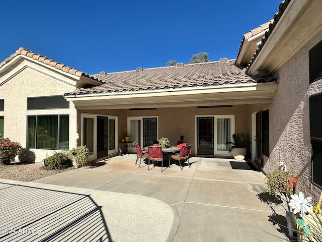 back of property featuring a patio area