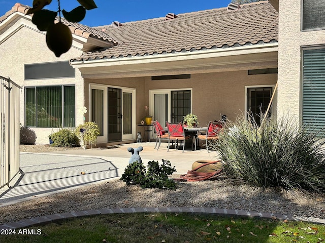 rear view of house featuring a patio area