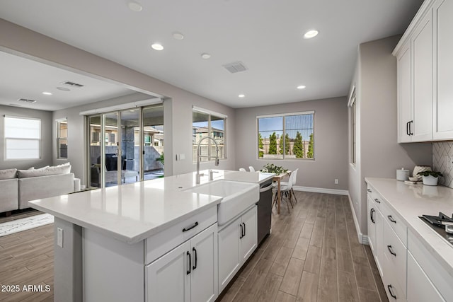 25725 S 230th St, Queen Creek, AZ 85142 - kitchen featuring a wealth of natural light, wood finished floors, dishwashing machine, and a sink
