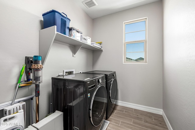 25725 S 230th St, Queen Creek, AZ 85142 - laundry room featuring laundry area, wood finished floors, visible vents, independent washer and dryer, and baseboards