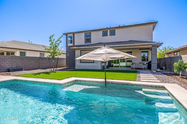 25725 S 230th St, Queen Creek, AZ 85142 - back of house with a fenced in pool, a fenced backyard, stucco siding, a patio, and a lawn