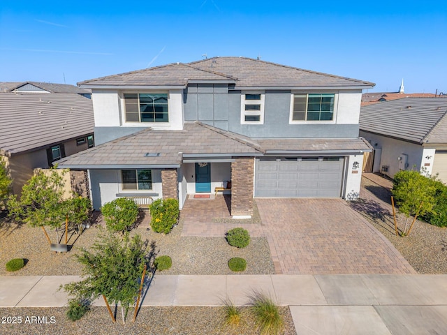 25725 S 230th St, Queen Creek, AZ 85142 - traditional-style house featuring an attached garage, decorative driveway, and stucco siding