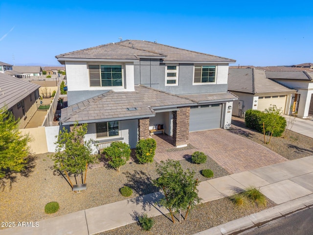 25725 S 230th St, Queen Creek, AZ 85142 - traditional-style house featuring stucco siding, fence, a garage, and decorative driveway