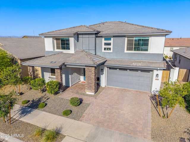 25725 S 230th St, Queen Creek, AZ 85142 - traditional-style house featuring stucco siding, an attached garage, fence, and decorative driveway
