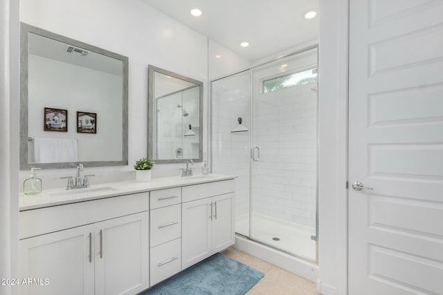 bathroom with vanity and an enclosed shower