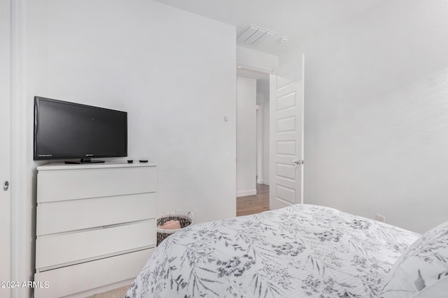 bedroom with hardwood / wood-style flooring