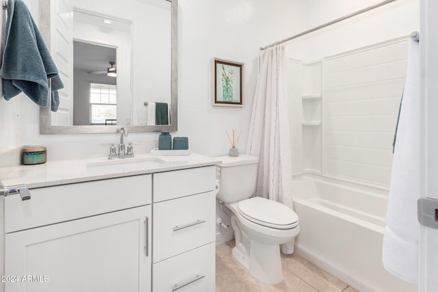 full bathroom with shower / bath combo, toilet, ceiling fan, vanity, and tile patterned flooring