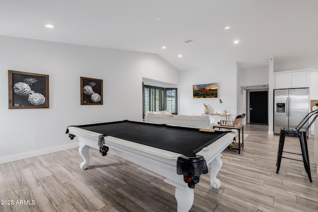 game room featuring pool table, vaulted ceiling, and light hardwood / wood-style floors