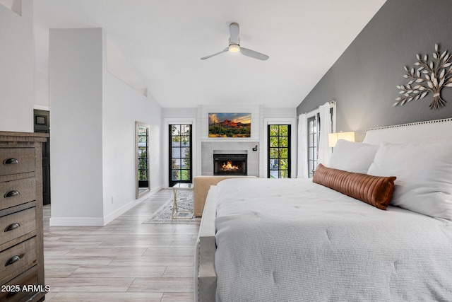 bedroom featuring multiple windows, high vaulted ceiling, and ceiling fan