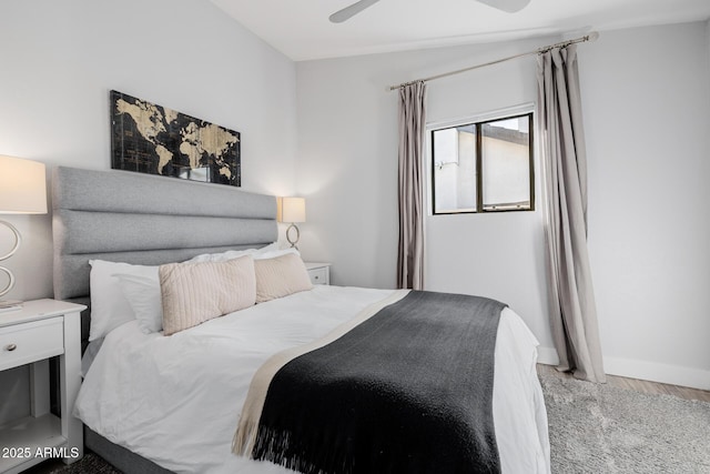 bedroom with ceiling fan and wood-type flooring