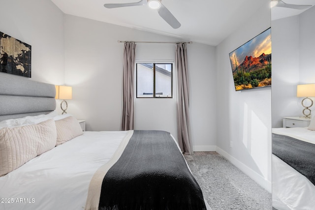 bedroom with ceiling fan, lofted ceiling, and carpet