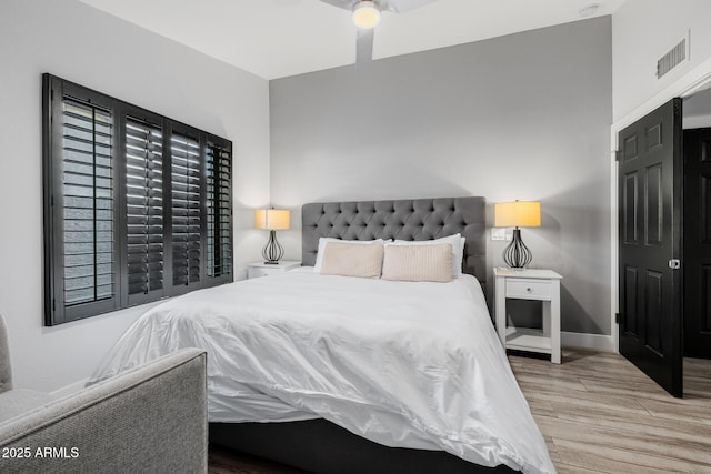 bedroom with hardwood / wood-style flooring