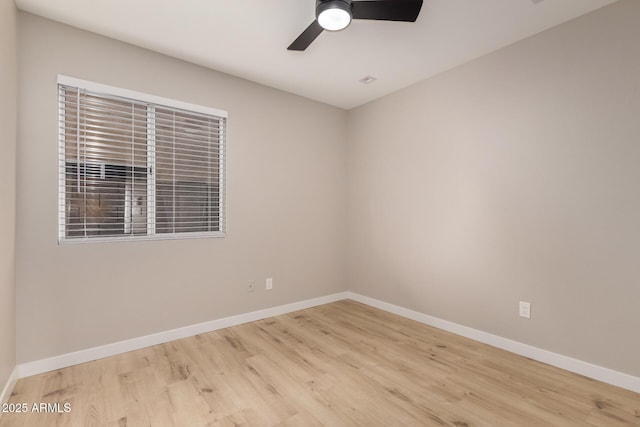 unfurnished room featuring ceiling fan and light wood-type flooring