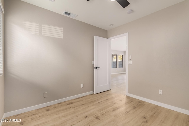 spare room featuring ceiling fan and light wood-type flooring