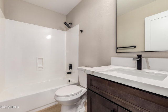 full bathroom featuring shower / tub combination, wood-type flooring, vanity, and toilet