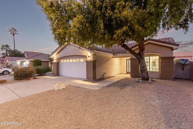 mediterranean / spanish-style house featuring a garage