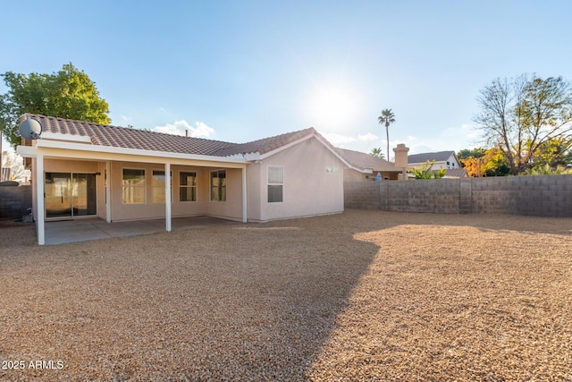 rear view of house with a patio