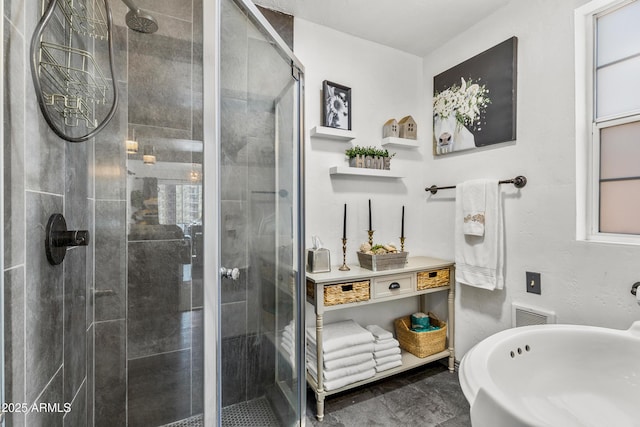 bathroom featuring a shower stall and visible vents