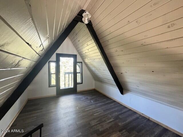 bonus room with wood ceiling, lofted ceiling, and dark wood-type flooring