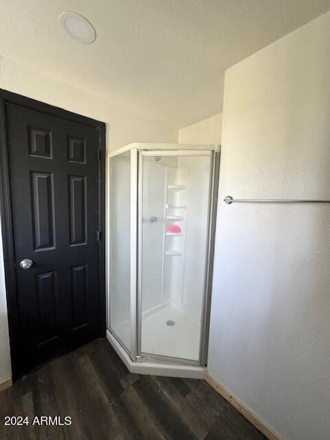 1725 Turkey Mountain Rd, Happy Jack, AZ 86024 - full bath featuring a stall shower and wood finished floors