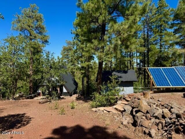 1725 Turkey Mountain Rd, Happy Jack, AZ 86024 - exterior space with ground mounted solar panels