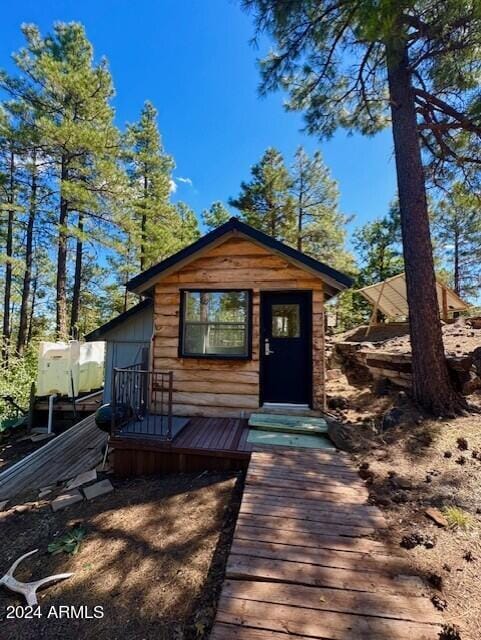 rear view of house with a deck