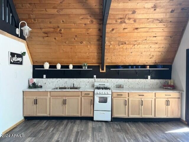 kitchen with dark wood-type flooring, sink, decorative backsplash, wooden walls, and white gas range