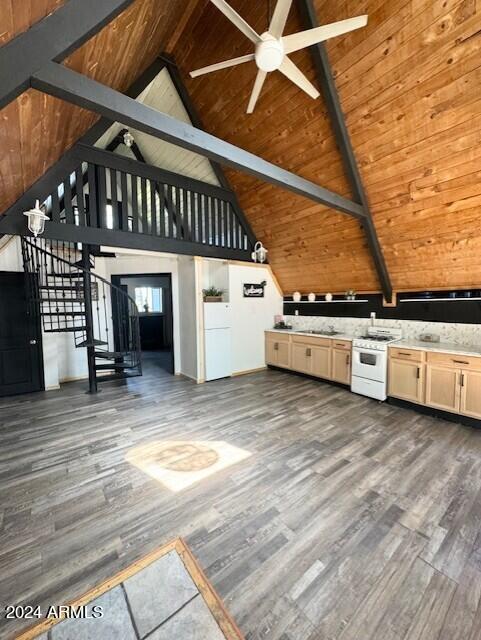 kitchen featuring dark wood-type flooring, beam ceiling, high vaulted ceiling, white appliances, and ceiling fan