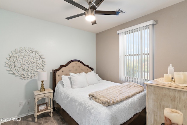 bedroom featuring dark hardwood / wood-style floors and ceiling fan