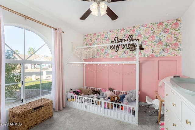 bedroom featuring multiple windows, light carpet, and ceiling fan