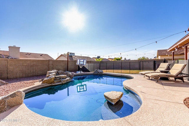 view of pool featuring a patio