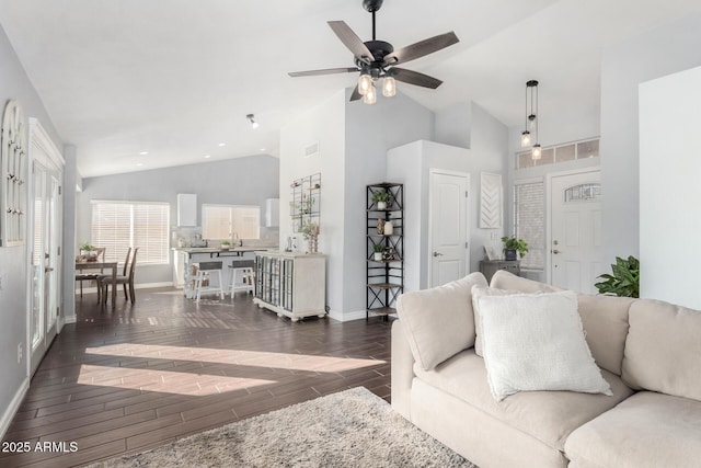 living room featuring sink, high vaulted ceiling, and ceiling fan